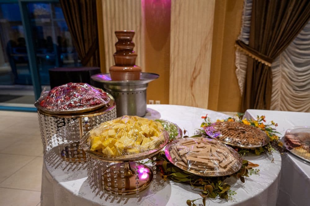 Dessert and chocolate fountain details at a reception.